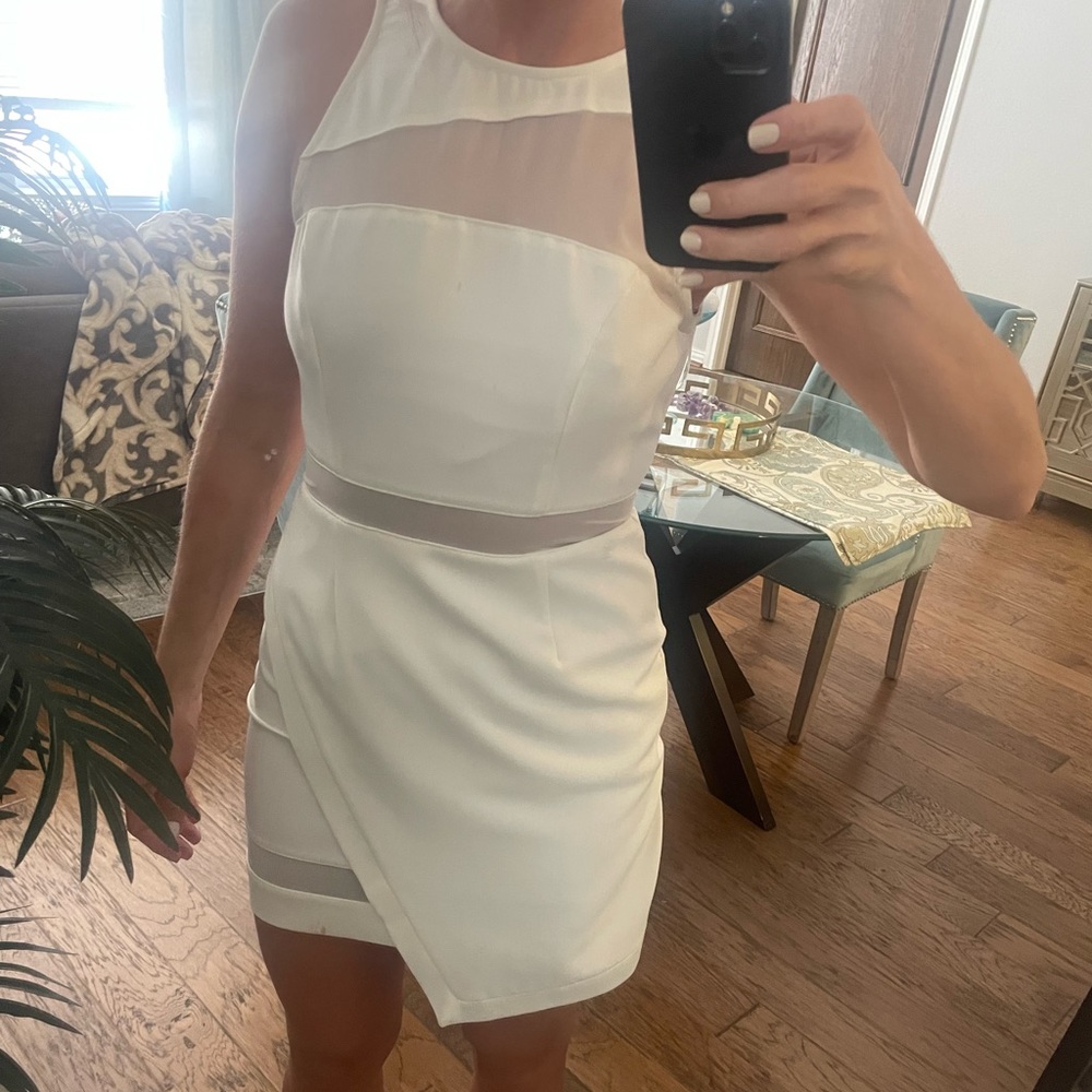 White sleeveless mini dress with sheer cutouts